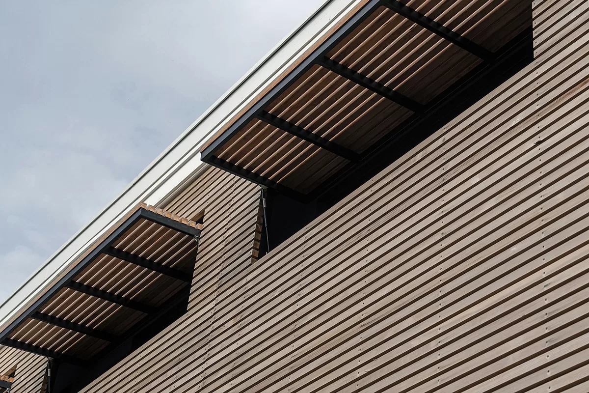 Architectural portfolio image of an architect designed new build house. Close up photo of the operable timber screens.