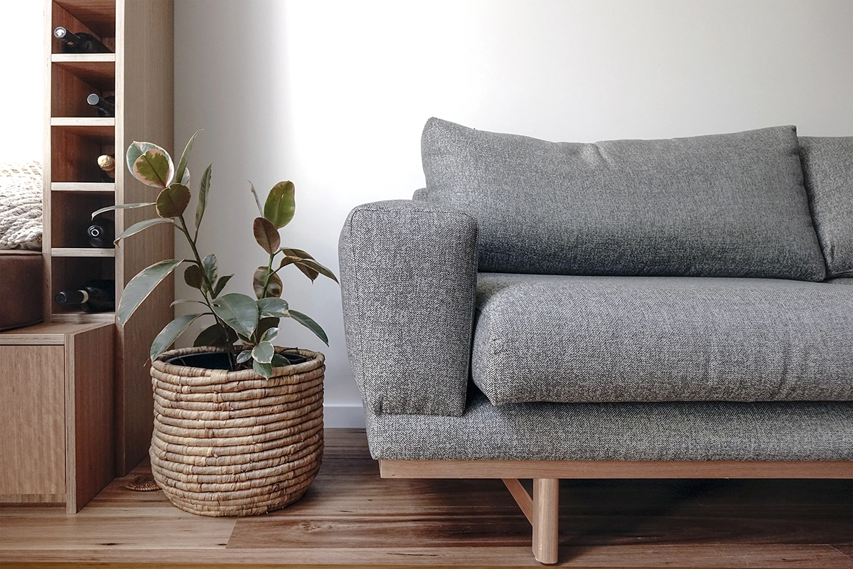 Image shows the new wine storage and couch in the renovation.