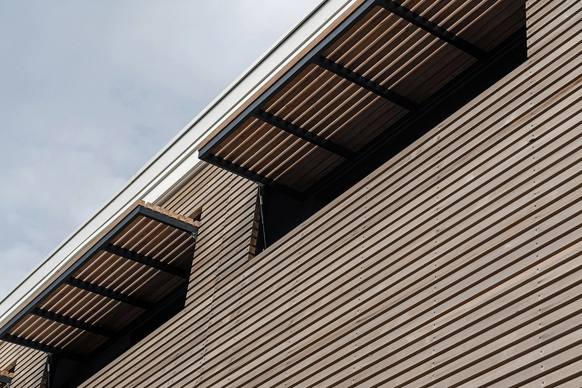 Architectural portfolio image of an architect designed new build house. Close up photo of the operable timber screens.