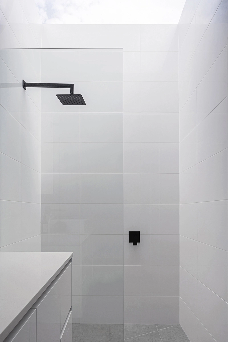 Bathroom image of an architect designed new build house. A large skylight sits over the shower.