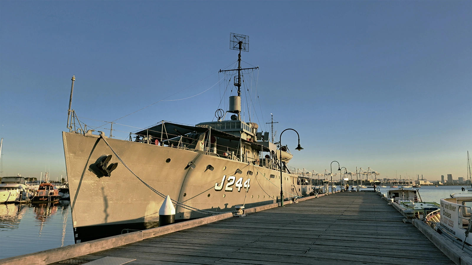 HMAS Castlemaine moored at Gem Pier in Williamstown at sunrise, waterfront context for a local architect in Williamstown