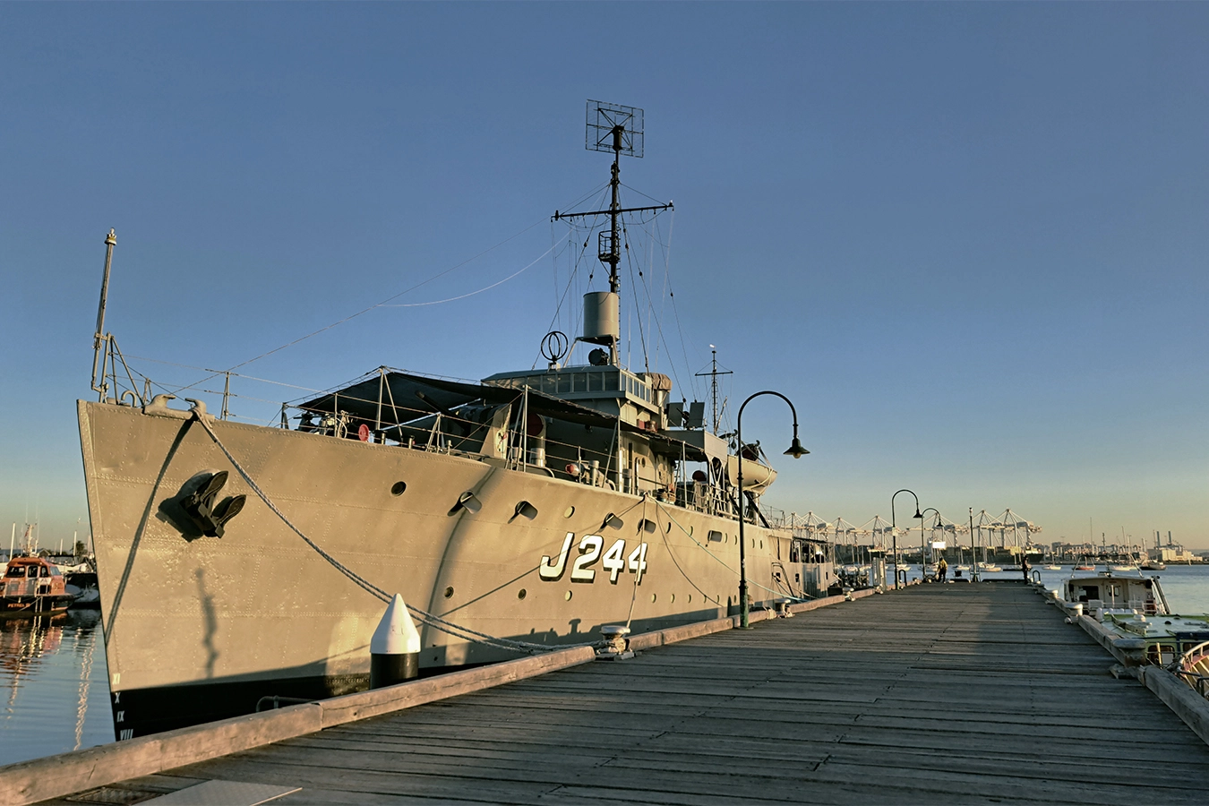 HMAS Castlemaine moored at Gem Pier in Williamstown at sunrise, waterfront context for a local architect in Williamstown